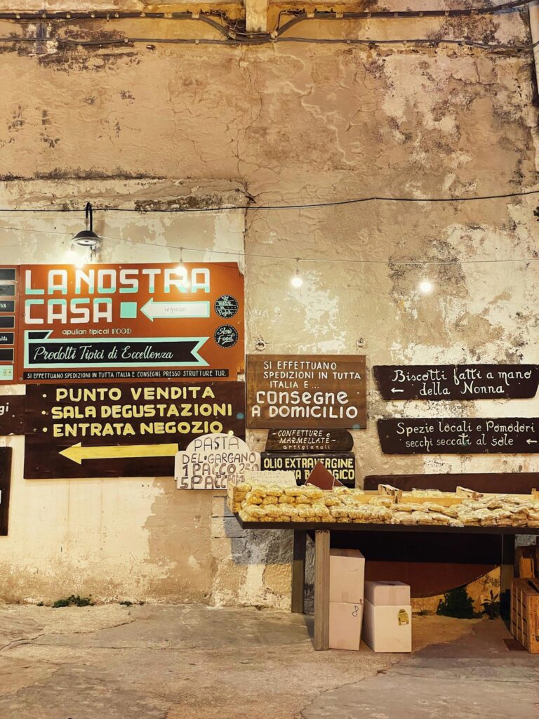 Rustic food stall in Puglia, Italy showcasing local handmade products and traditional specialties.